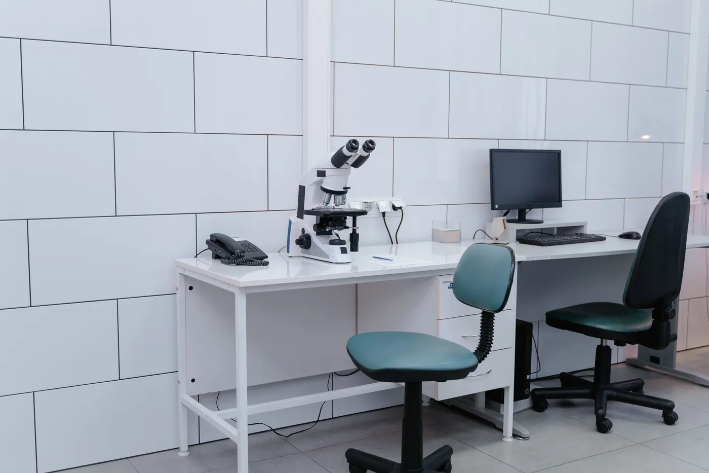 Clinical workstation with microscope and computer